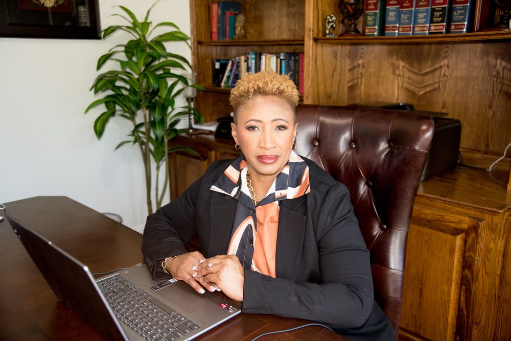 Constance Goree working at her desk on financial operations